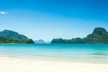 Fototapeta na wymiar Fabulous exotic beach with white sand and high palm trees