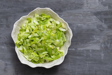 cabbage on the beautiful white bowl on ceramic background