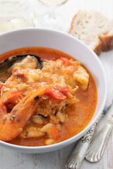 typical portuguese fish and seafood stew caldeirada in dish on ceramic background