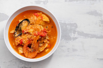 typical portuguese fish and seafood stew caldeirada in dish on ceramic background