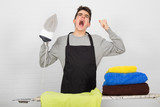 stressed man ironing clothes