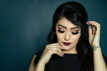 Beauty looking down with hands to the face