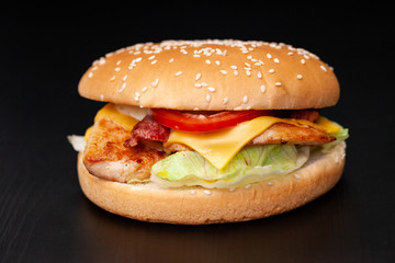 fresh tasty burger on black background