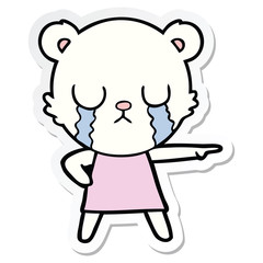 sticker of a crying polar bear in dress pointing