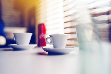 Cup of coffee on the table at the cafe shop