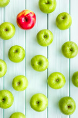 food pattern with green apples on light wooden background top view