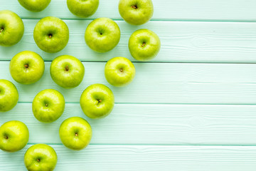 green apples for organic summer food pattern on light wooden background top view mockup
