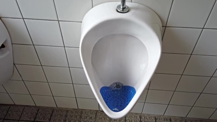 Close up of dirty urinal men public toilet