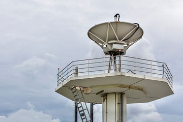 High technology satellite dish station on cloudy sky day background