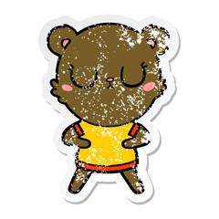 distressed sticker of a peaceful cartoon bear