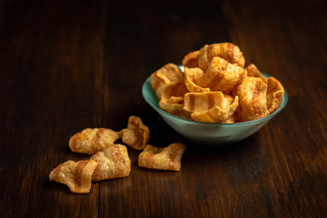 chipss in a bowl on a wooden table