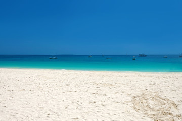 Fototapeta na wymiar Wonderful white sandy beach on paradise Zanzibar island
