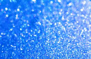 Naklejka na ściany i meble Blue glitter texture christmas abstract background. Shiny wrapping paper texture, greeting card design element.