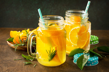 Cold summer drink set. Refreshing summer berry Lemonade, lemon mint Tea and orange Lemonade with rosemary.