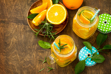 Cold summer drink set. Refreshing summer berry Lemonade, lemon mint Tea and orange Lemonade with rosemary. Copy space.