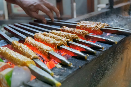 Chicken seekh kababs are being prepared road side