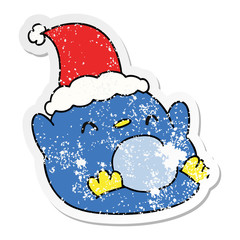 christmas distressed sticker cartoon of kawaii penguin