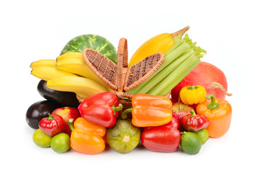 Set of vegetables and fruits in a wicker basket isolated on white background.