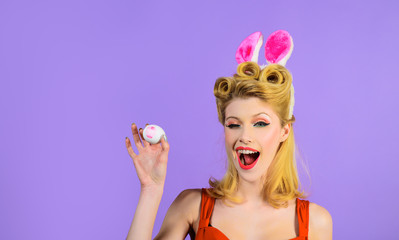 Happy Easter! Easter day. Spring holiday. Woman with bunny ears holds white egg. Egg hunt. Easter bunny. Easter concept. White eggs. Bunny girl. Kiss. Decorating eggs.