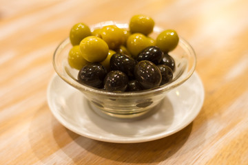 Olives in a cup on a table in Barcelona, Spain