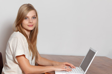 Young woman using a notebook computer indoors