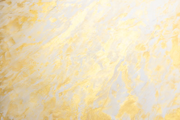 Abstract golden textured hand painted background closeup