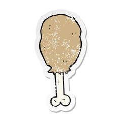 distressed sticker of a cartoon chicken leg