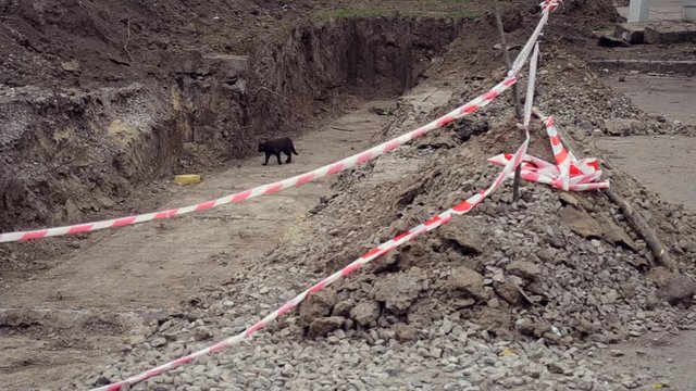 Pit dug protective red tape