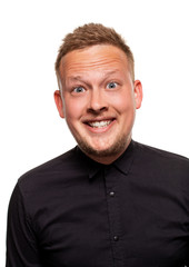 Obraz premium Close up portrait of a confident, blond, handsome young man wearing black shirt, isolated on white background
