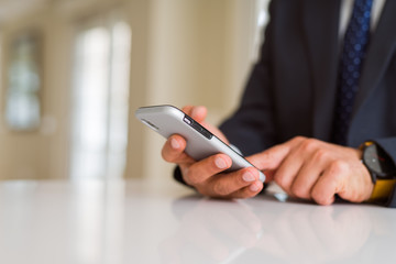 Close up of business man hands using smarpthone