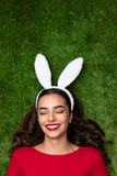 Content beautiful woman in Easter bunny ears 