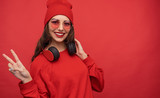 Hipster girl in red trendy clothing 