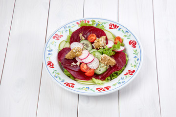 beetroot carpaccio on the wooden background