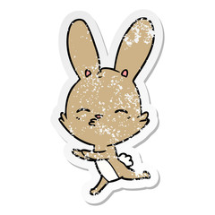 Obraz premium distressed sticker of a curious bunny cartoon