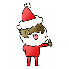 man with beard sticking out tongue wearing santa hat