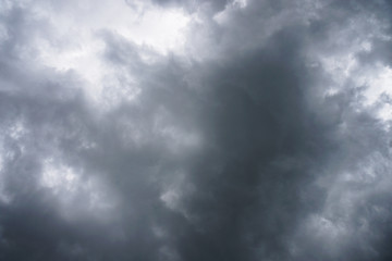 Dark, grim, stormy, rainy sky with rays of light. Scary hurricane clouds. Natural element. Stock...
