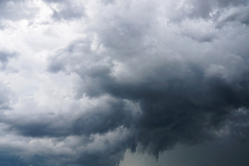 Dark, grim, stormy, rainy sky with rays of light. Scary hurricane clouds. Natural element. Stock...