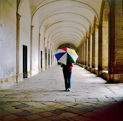 Lady with umbrella walking in the galleries