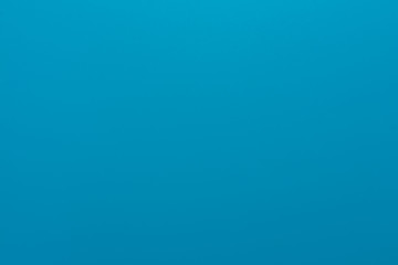 Texture in a bright, blue color illuminated with a delicate light.
