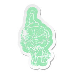 cartoon distressed sticker of a undead vampire girl wearing santa hat