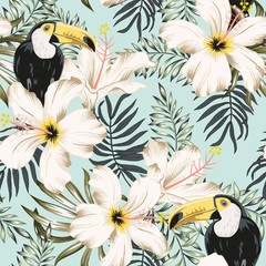 Toucans, white hibiscus flowers, palm leaves, light blue background. Vector floral seamless pattern. Tropical illustration. Exotic plants, birds. Summer beach design. Paradise nature