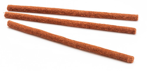 Tibetan incense sticks (red sandalwood). Isolated on white background.