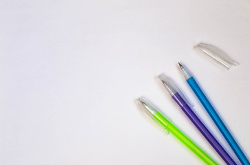 Colored pens on a white background. View from above. copy space