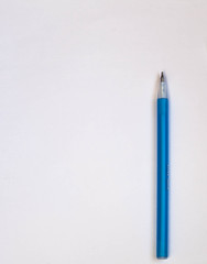 Blue pen on a white background. View from above. copy space