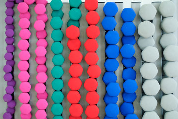 Light Dumbbells for boxing and fitness as well as aerobics are stored in a special steel stand of gray color and waiting in the wings for athletes to use them dumbbells wall.