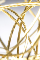 Golden wires isolated on bright background