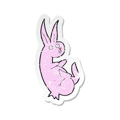retro distressed sticker of a cue cartoon rabbit