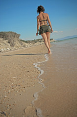 Girl walking on the beach