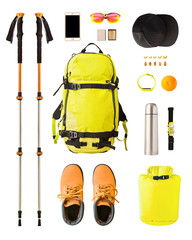 Flat lay of sport equipment and gear for hiking and trekking. Top view of walking poles, backpack,...