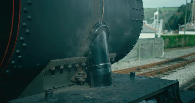 Steam train stopped at the platform